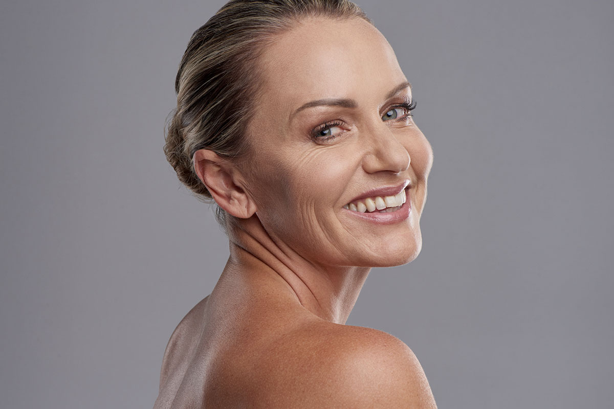 Smiling woman after a neck lift in Naples